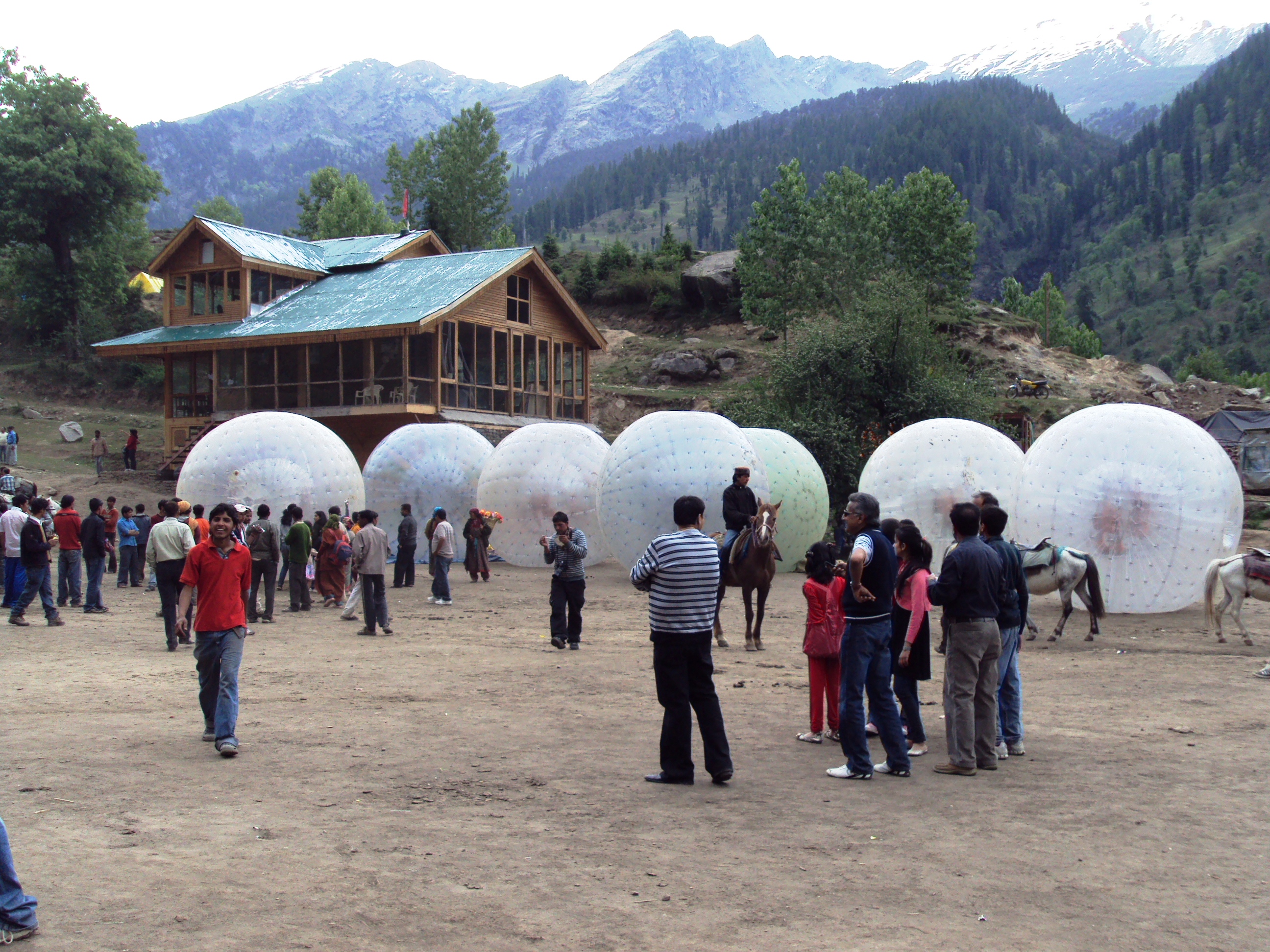 tourist enjoying zorbing in solang valley manali