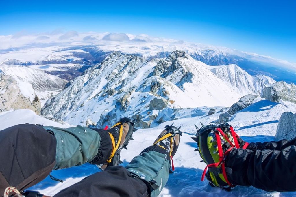 trekkers wearing crampons for climb