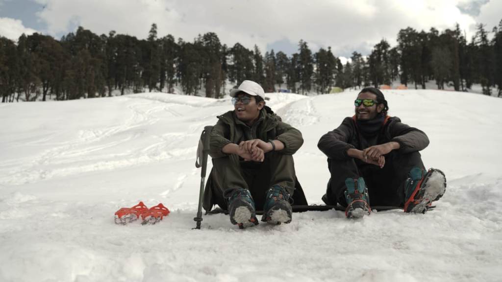 trekkers wearing microspikes for climb