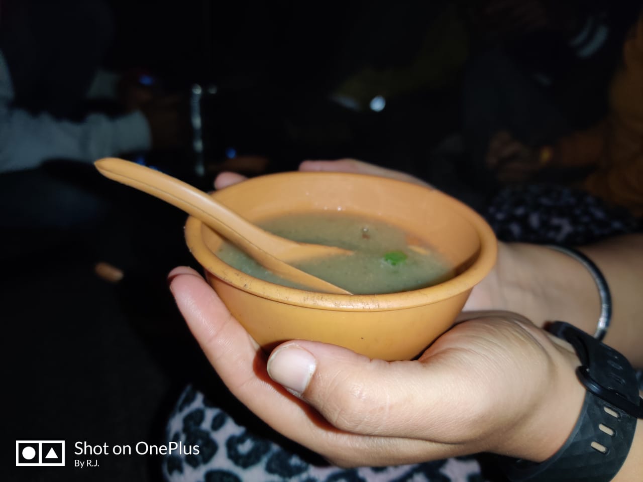 Trekker holding a soup bowl