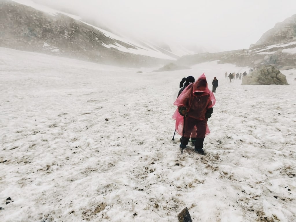 crossing the snow covered hampta pass