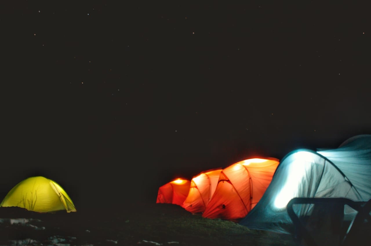 Tents placed under sky full of stars