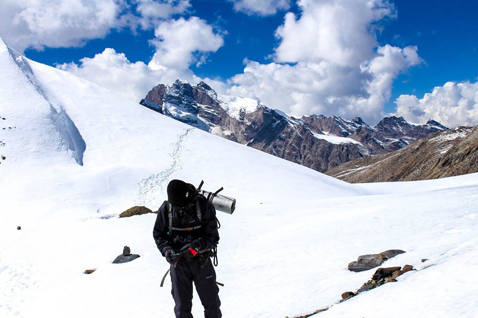 solo trekking through snow covered mountains