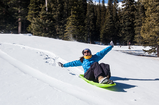 Tabogganing in winter snow