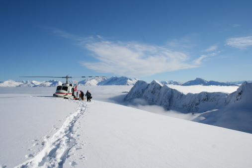 Heli skiing in winters field covered in snow