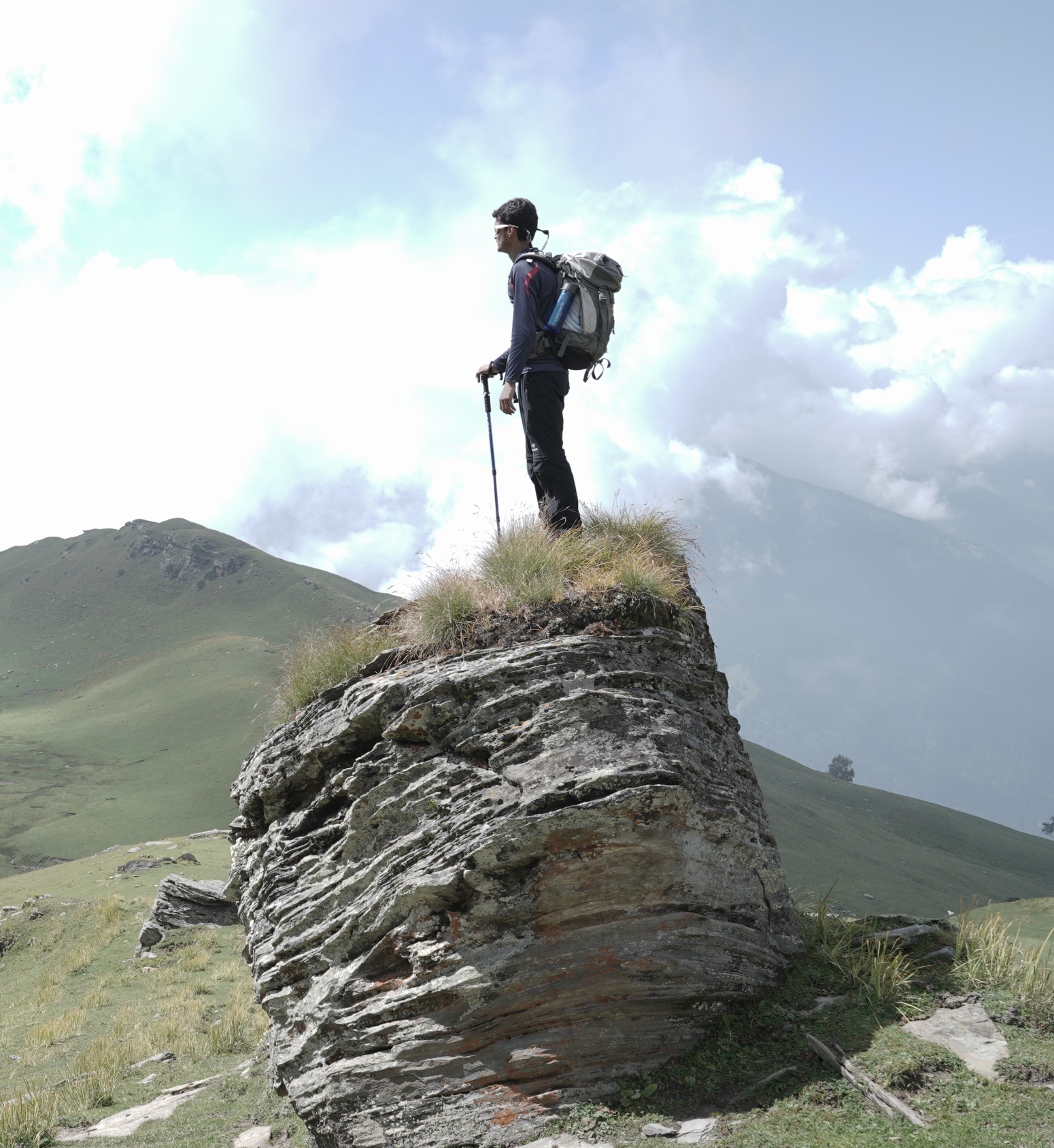 trekking wearing quick dry clothers and with gears on a trek