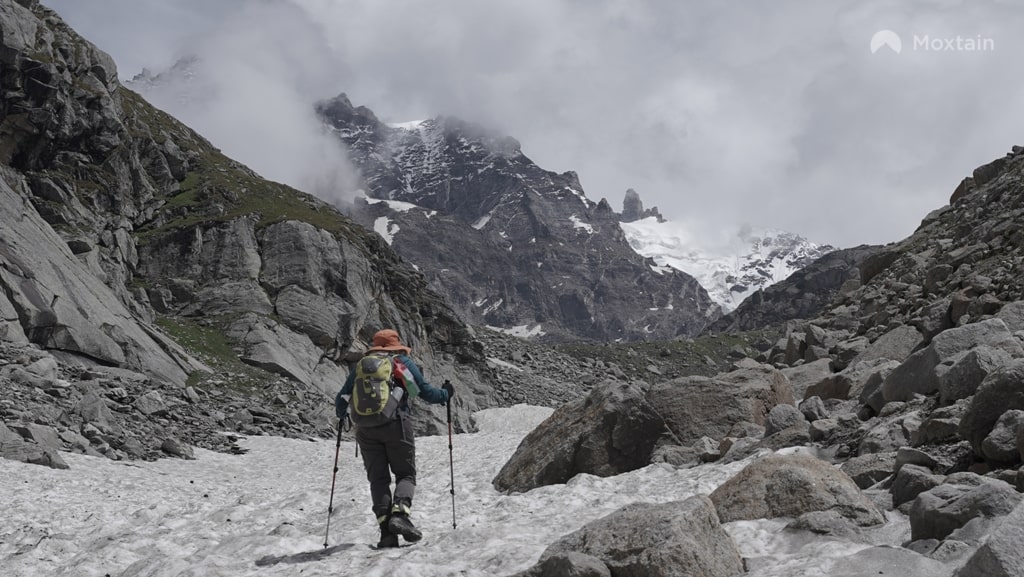 trekker holding paired trekking poles