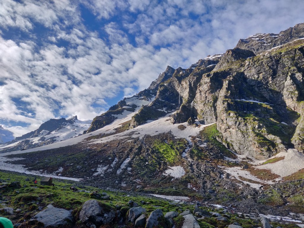 single tent pitched on the foot of beautiful mountian enroute hampta pass