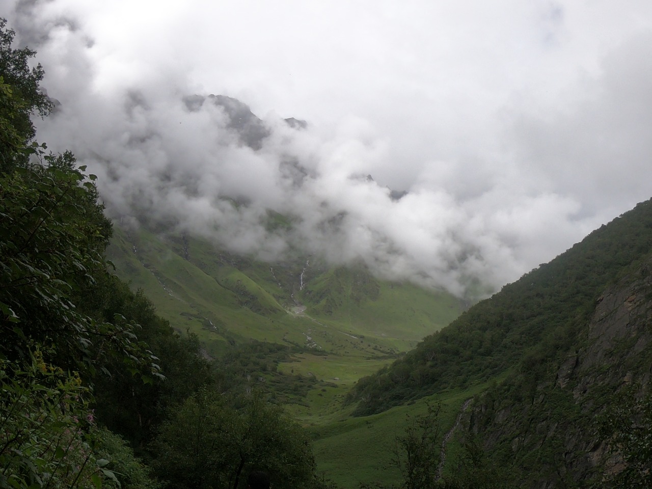 Cloud floating below green mountain enroute to Valley of flower